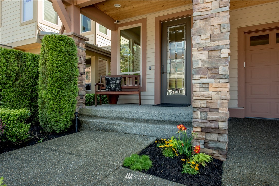 1105 North 41st Place Renton, WA 98056 - Photo 2 of 40 a front view of a house with a garden