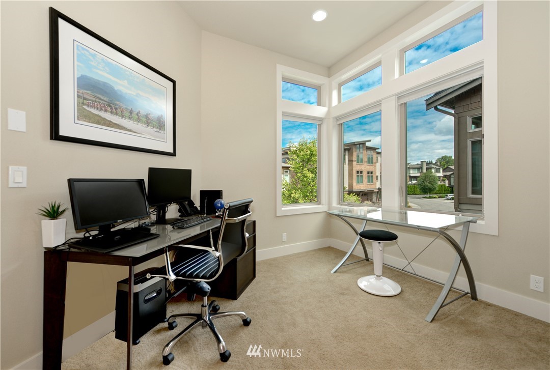 1105 North 41st Place Renton, WA 98056 - Photo 16 of 40 a view of a workspace with furniture and a window
