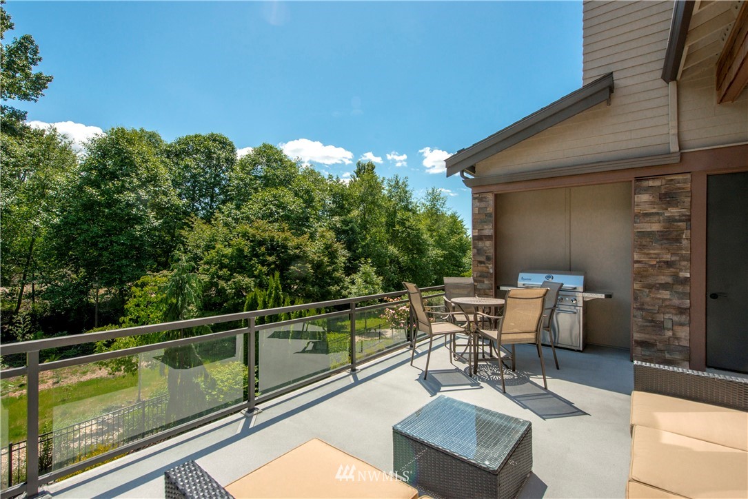 1105 North 41st Place Renton, WA 98056 - Photo 18 of 40 a view of a chairs and table in the balcony