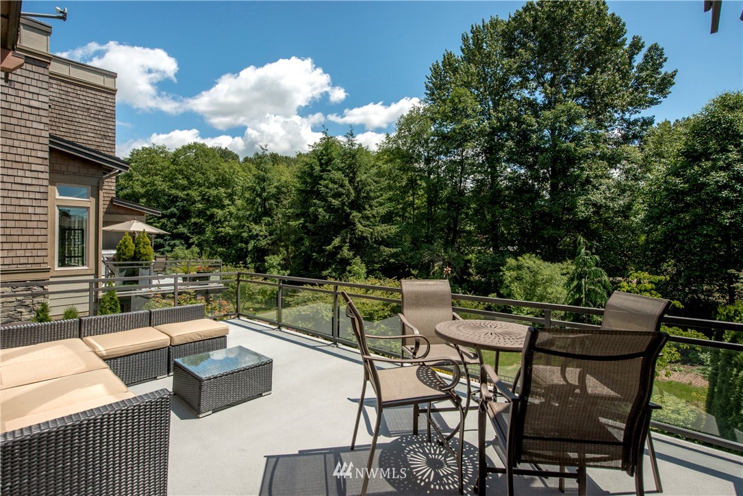 1105 North 41st Place Renton, WA 98056 - Photo 19 of 40 a view of patio with couches table and chairs and potted plants