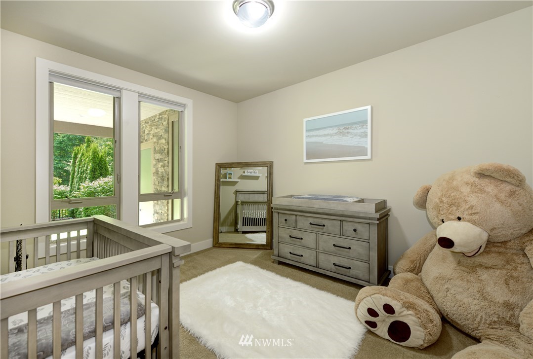 1105 North 41st Place Renton, WA 98056 - Photo 23 of 40 a bedroom with a bed and a window