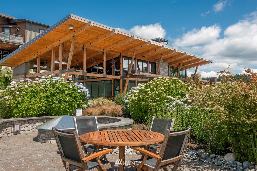 1105 North 41st Place Renton, WA 98056 - Photo 30 of 40 a view of a patio with table and chairs and potted plants