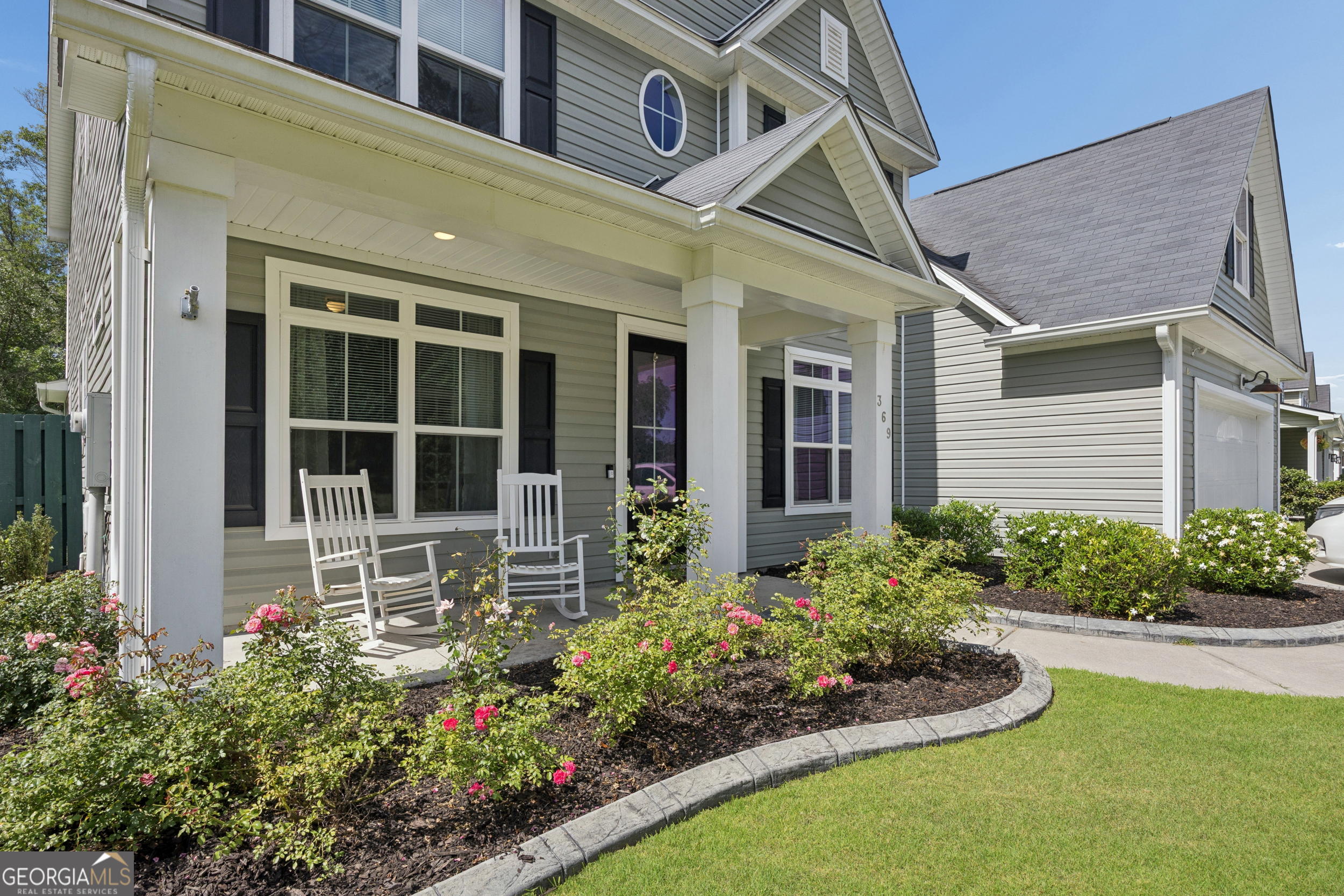 369 Waybridge Way Richmond Hill, GA 31324 - Photo 2 of 40 front view of a house with a yard