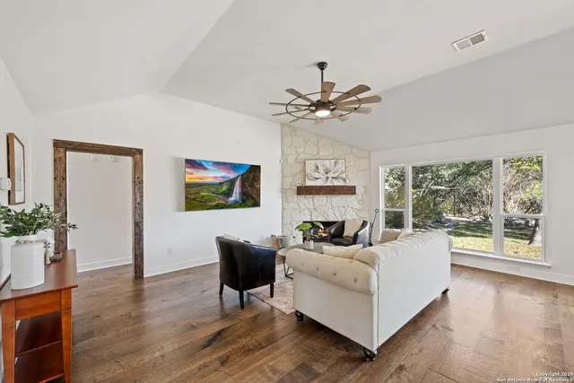 a living room with furniture and a large window