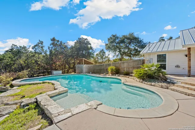 a view of a house with swimming pool