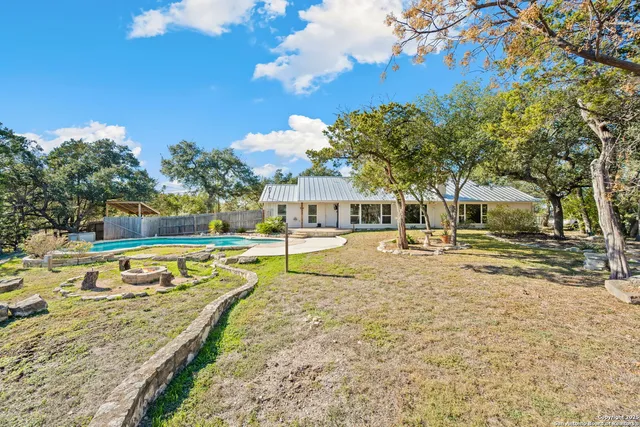 a view of yard with swimming pool