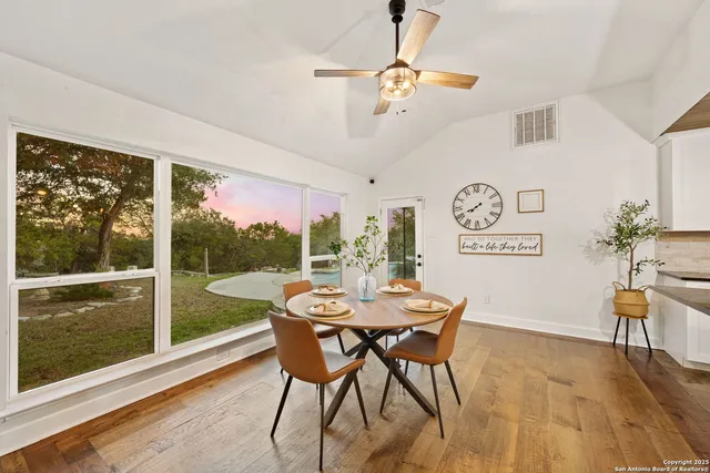 a view of a dining room with furniture window and outside view