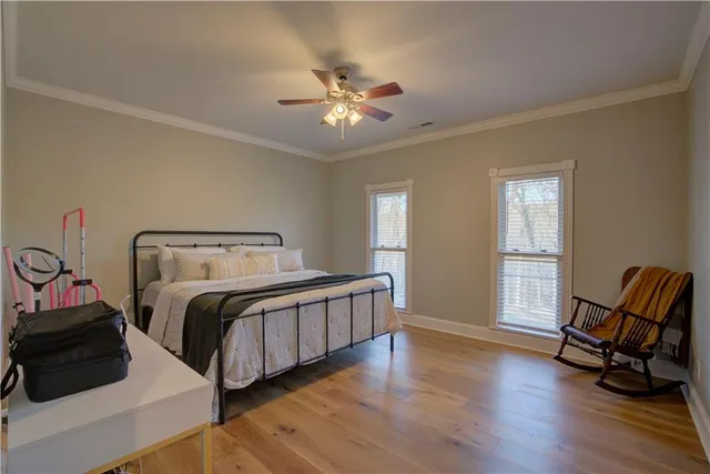 a bathroom with a toilet a sink and a mirror