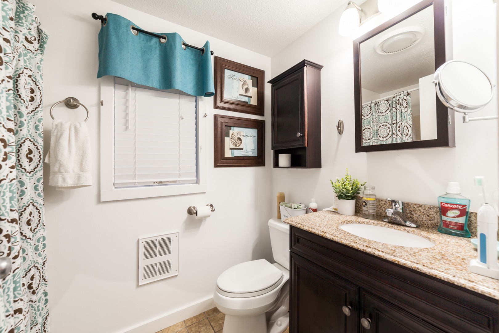 309 County Road Oak Bluffs, MA 02557 - Photo 13 of 32 a bathroom with a granite countertop toilet sink and mirror