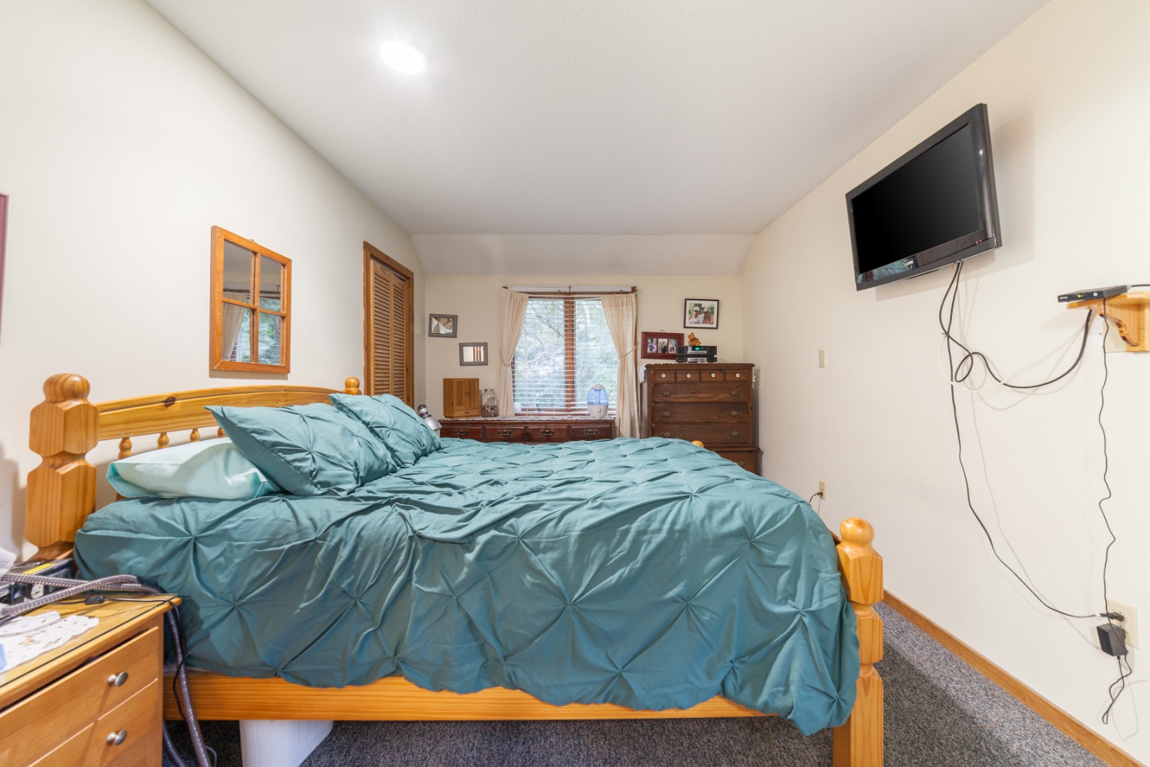 309 County Road Oak Bluffs, MA 02557 - Photo 14 of 32 a bedroom with a bed and a flat screen tv