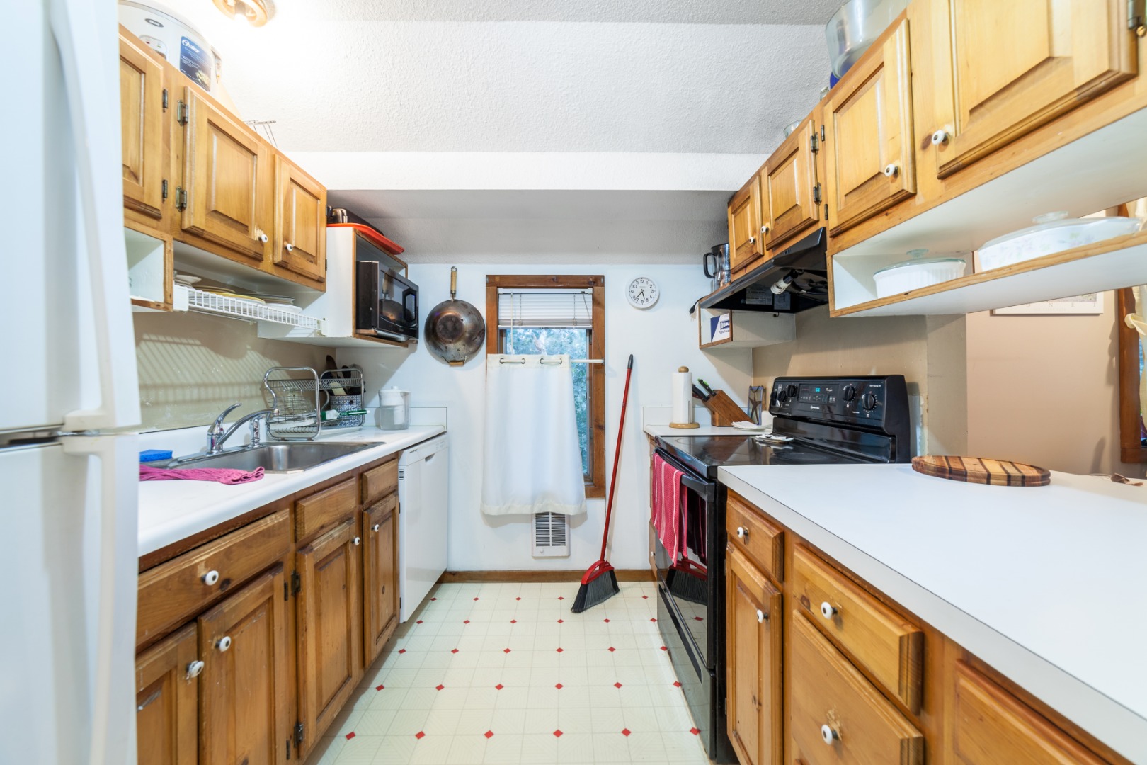 309 County Road Oak Bluffs, MA 02557 - Photo 18 of 32 a kitchen with a sink and cabinets