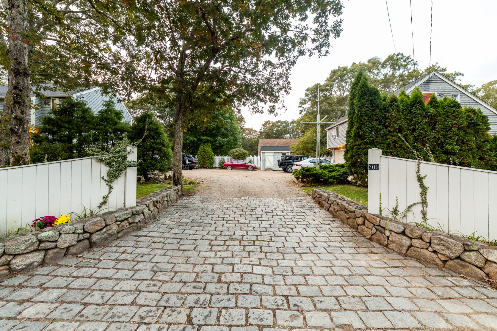 309 County Road Oak Bluffs, MA 02557 - Photo 2 of 32 a view of a backyard of the house
