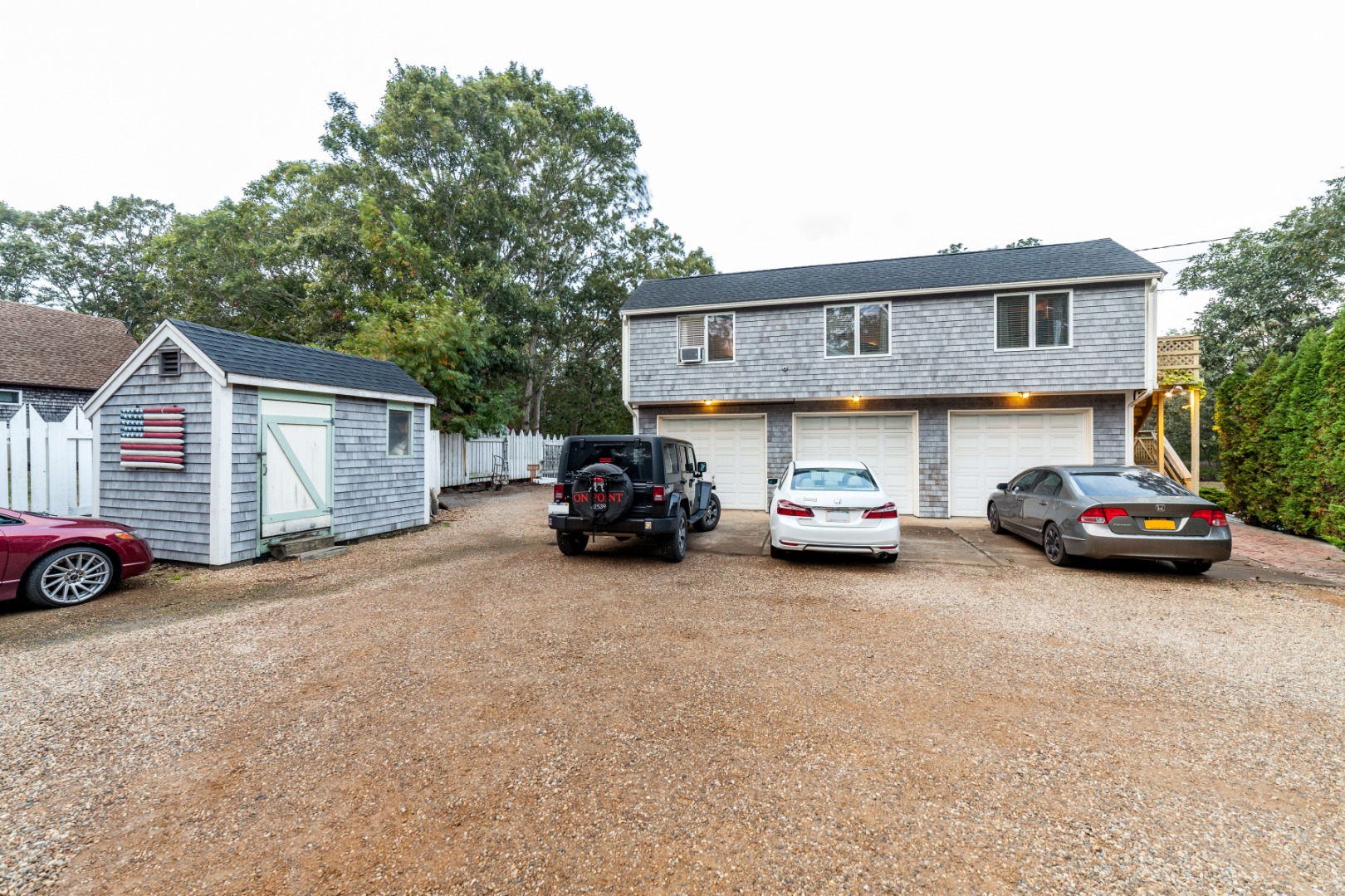309 County Road Oak Bluffs, MA 02557 - Photo 21 of 32 a view of a cars in front of a house