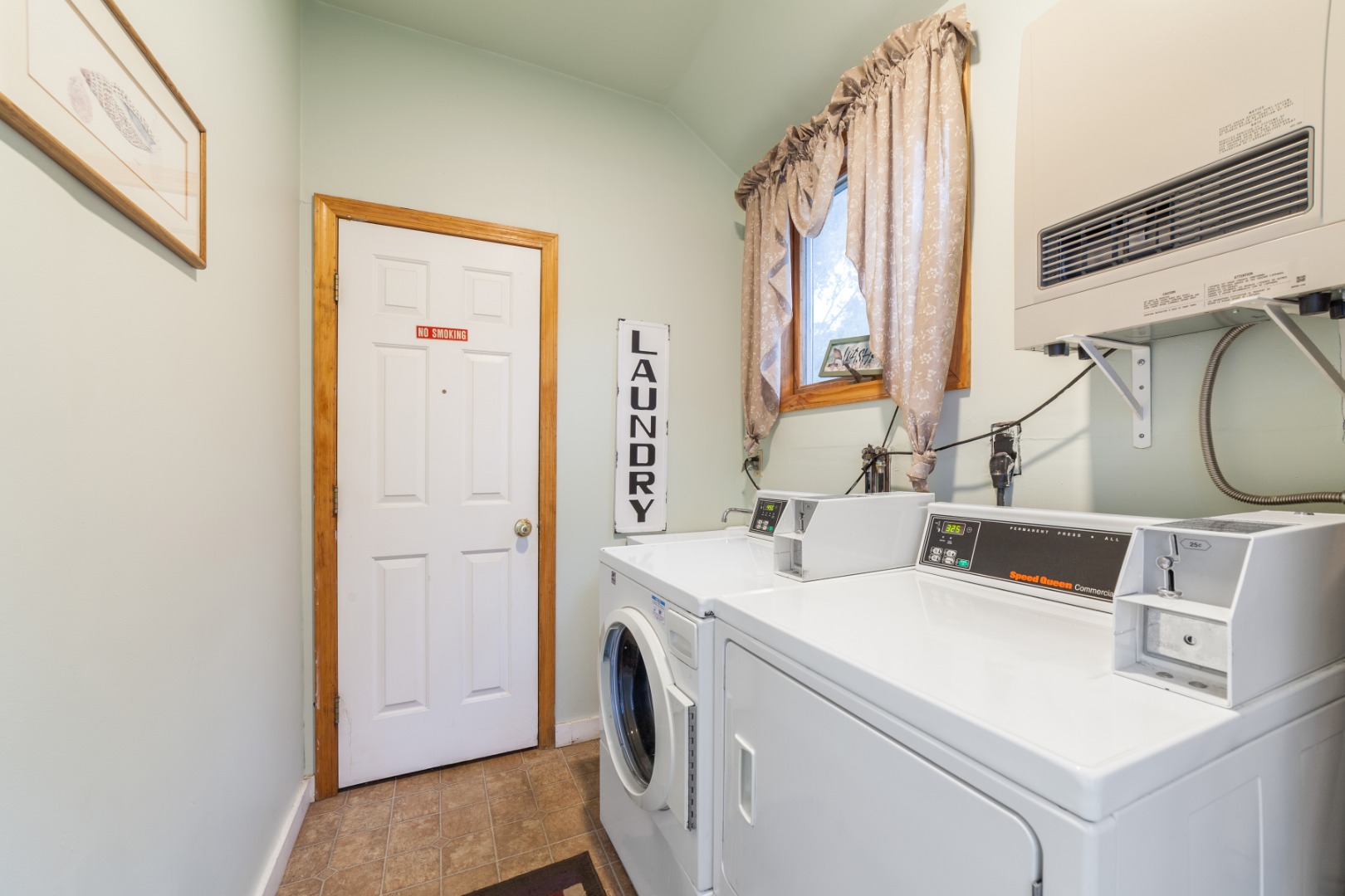 309 County Road Oak Bluffs, MA 02557 - Photo 22 of 32 a view of washer and dryer with bathroom in the background