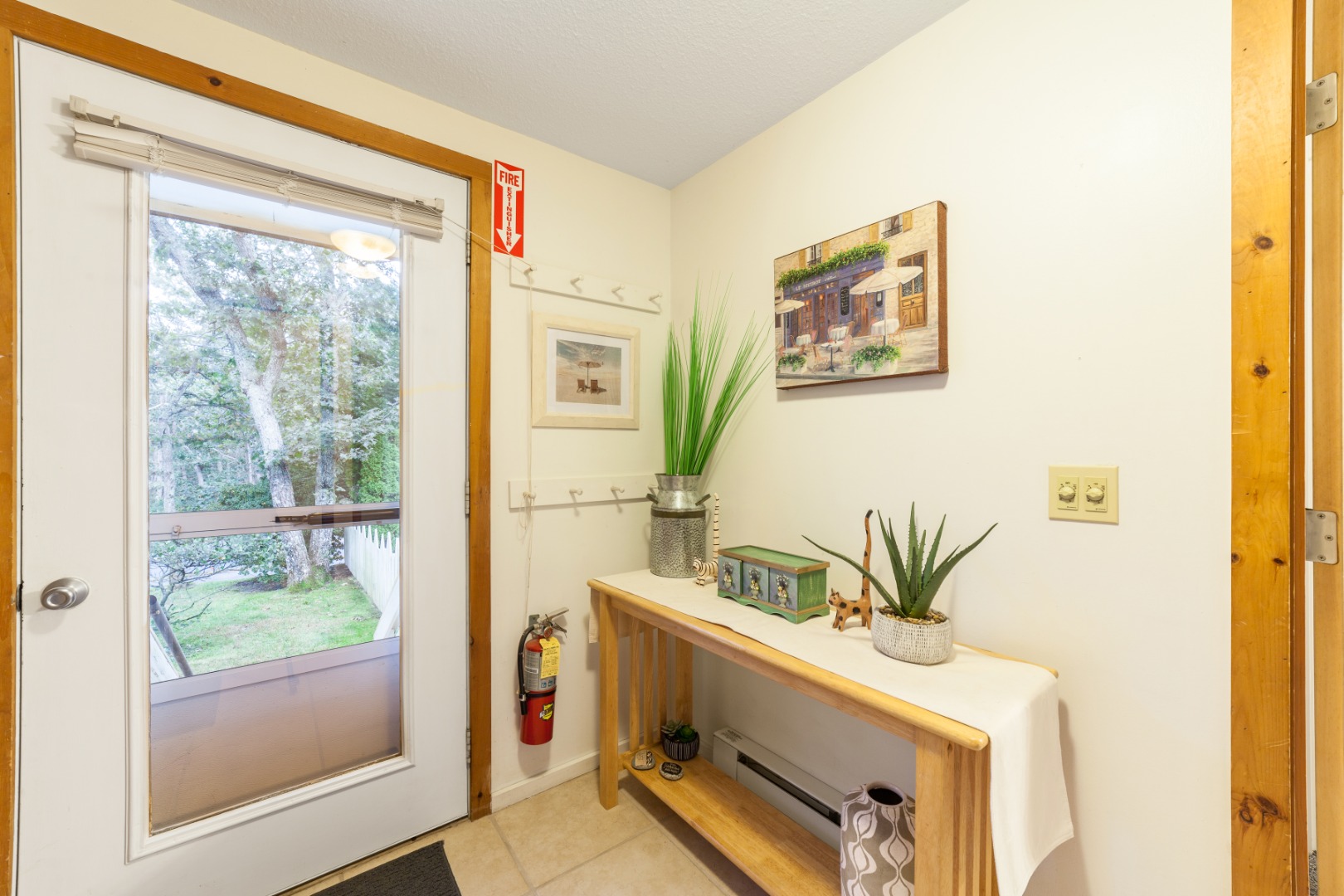309 County Road Oak Bluffs, MA 02557 - Photo 4 of 32 a room with a table and a potted plant