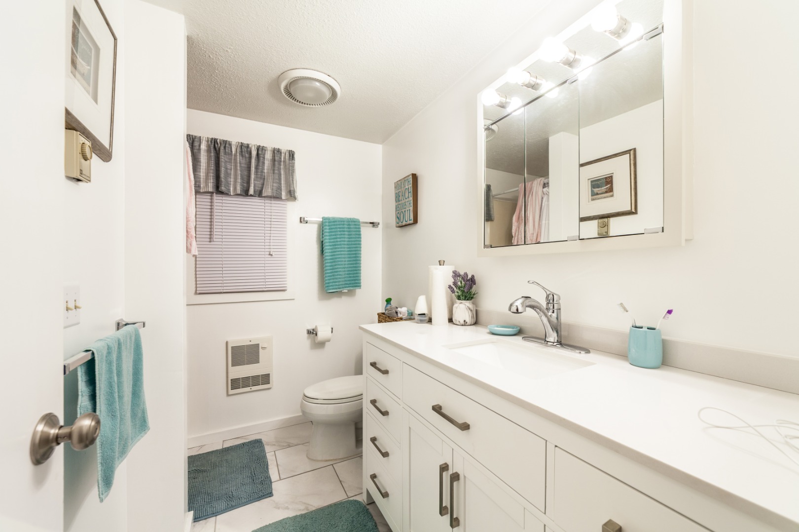 309 County Road Oak Bluffs, MA 02557 - Photo 6 of 32 a bathroom with a sink and a mirror