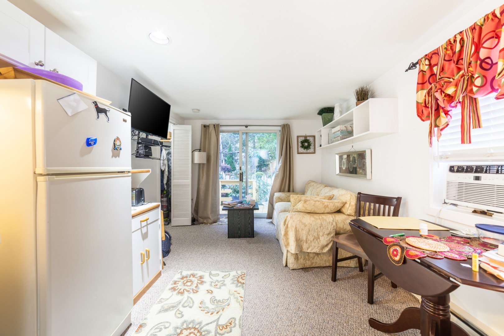 309 County Road Oak Bluffs, MA 02557 - Photo 9 of 32 a living room with furniture and a refrigerator