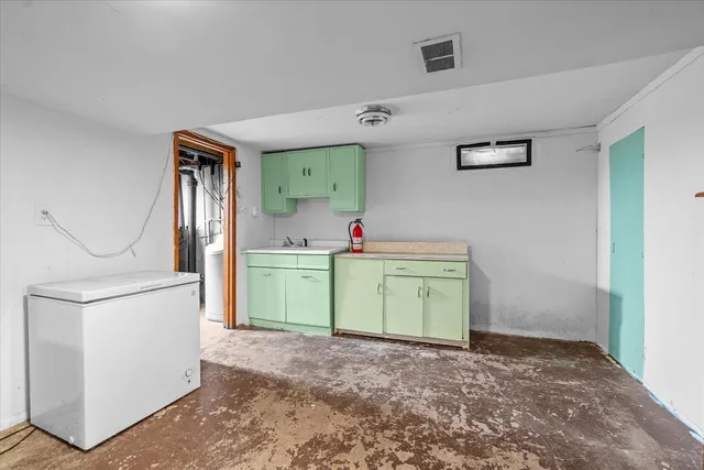 a room that has a sink and a mirror