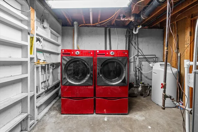 a utility room with closet dryer and washer