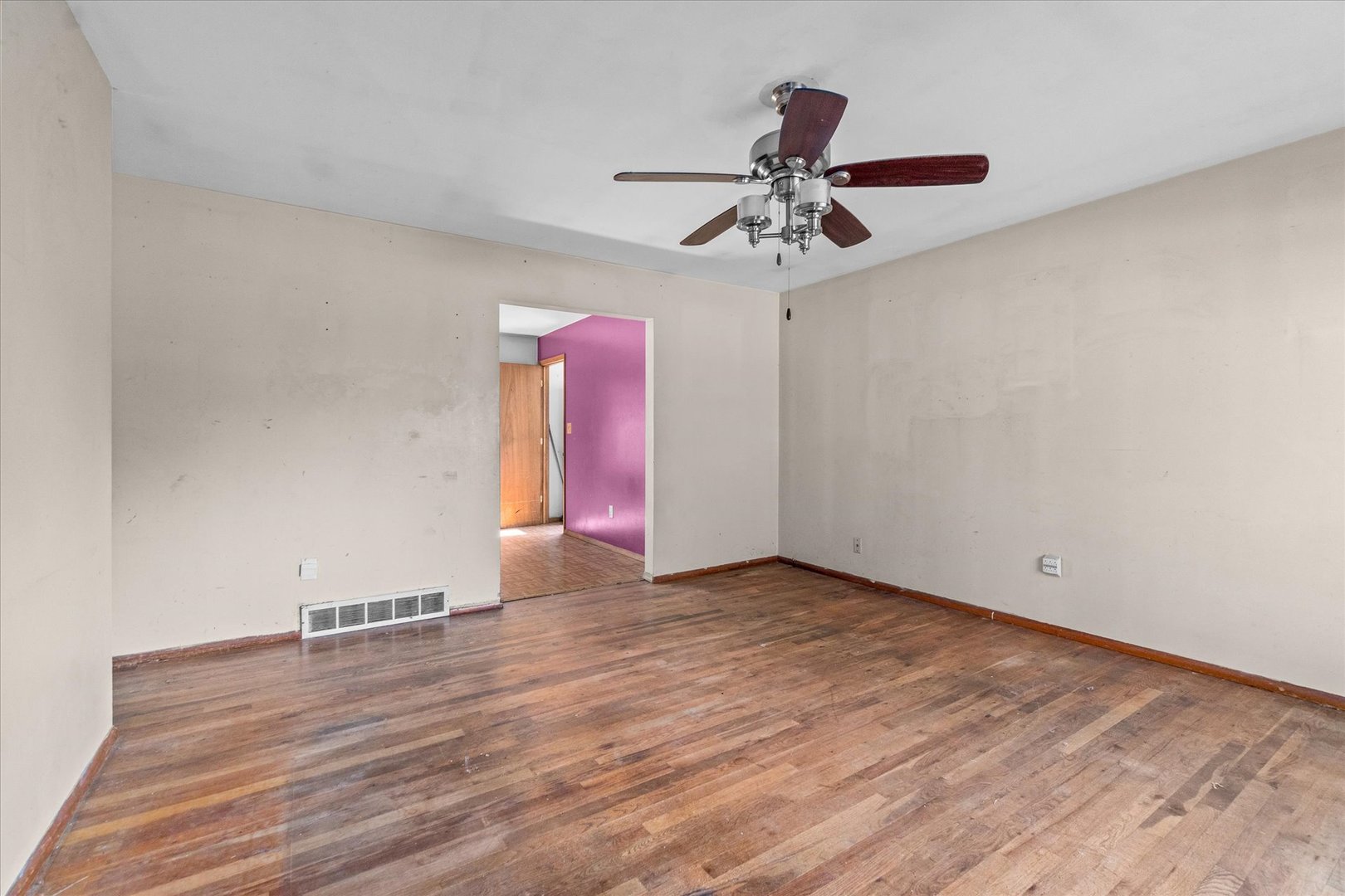 604 West Lee Street Plano, IL 60545 - Photo 4 of 17 a view of an empty room with a ceiling fan