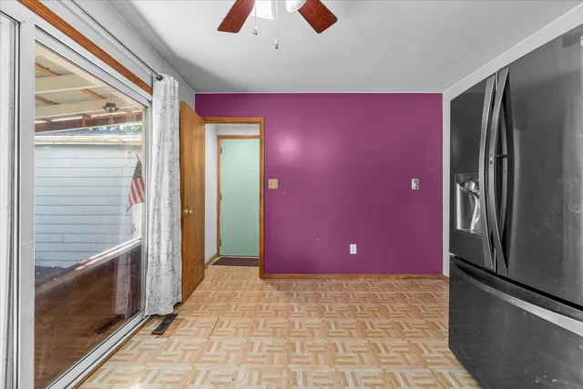a view of a livingroom with a red car garage