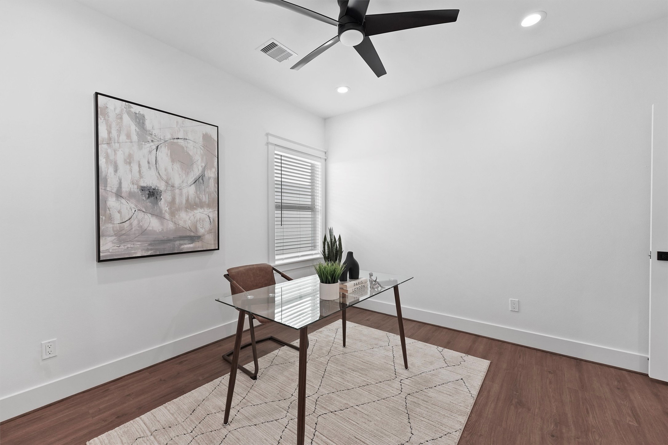 6130 Endeavor Heights Road Houston, TX 77091 - Photo 19 of 33 a workspace room with furniture and wooden floor