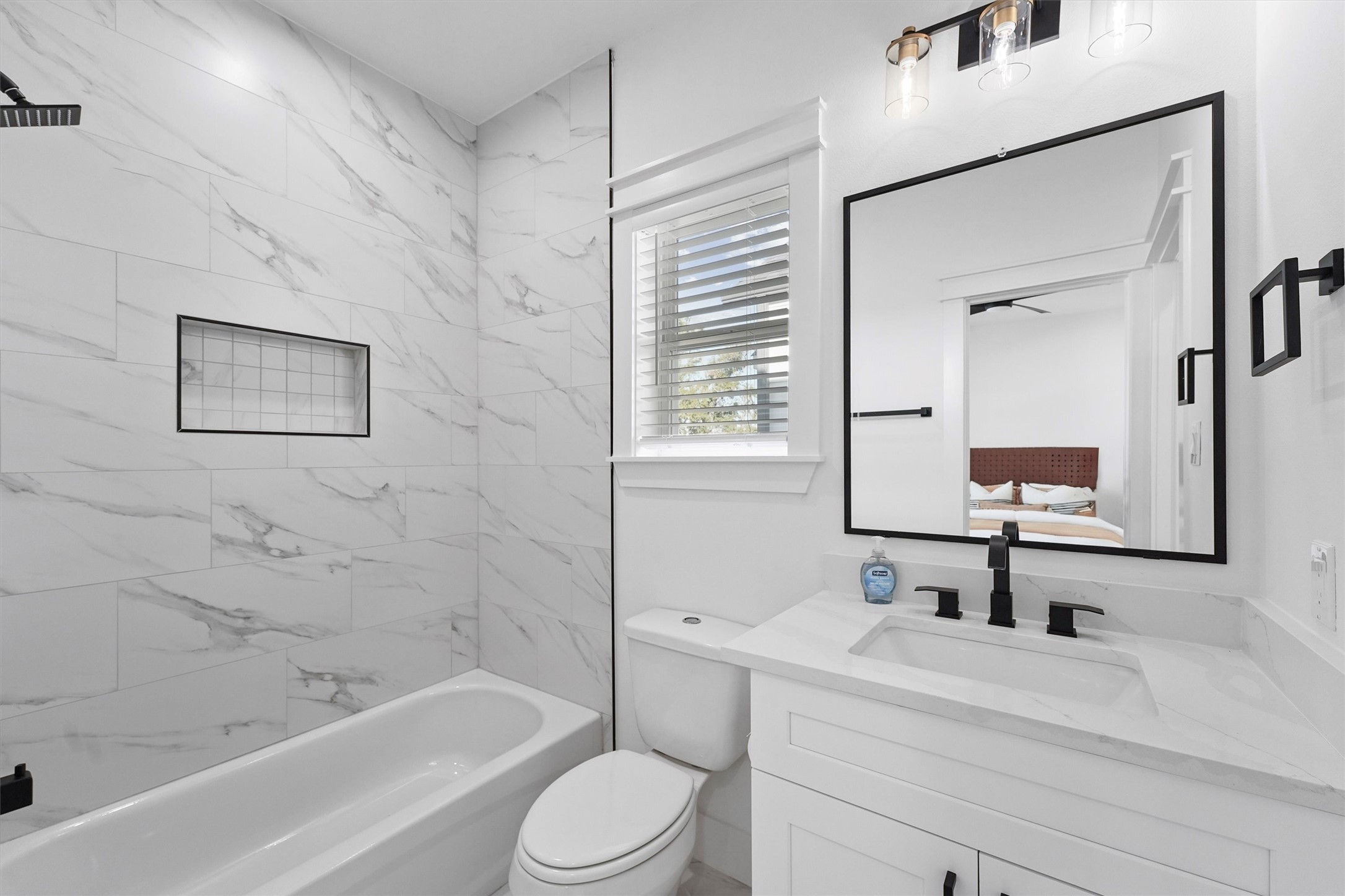 6130 Endeavor Heights Road Houston, TX 77091 - Photo 22 of 33 a bathroom with a bathtub shower sink vanity mirror and toilet