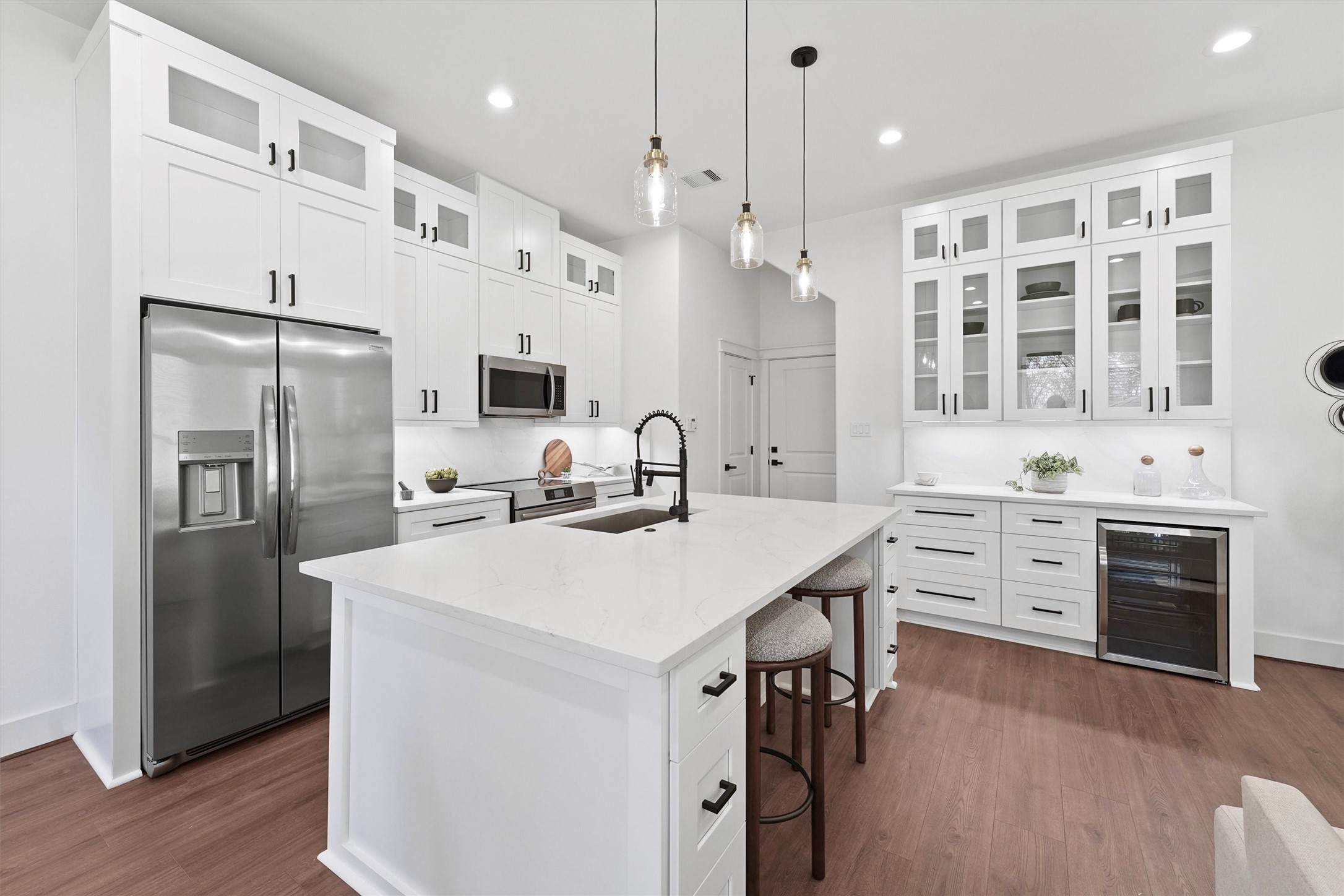 6130 Endeavor Heights Road Houston, TX 77091 - Photo 4 of 33 a kitchen with stainless steel appliances a refrigerator sink and stove
