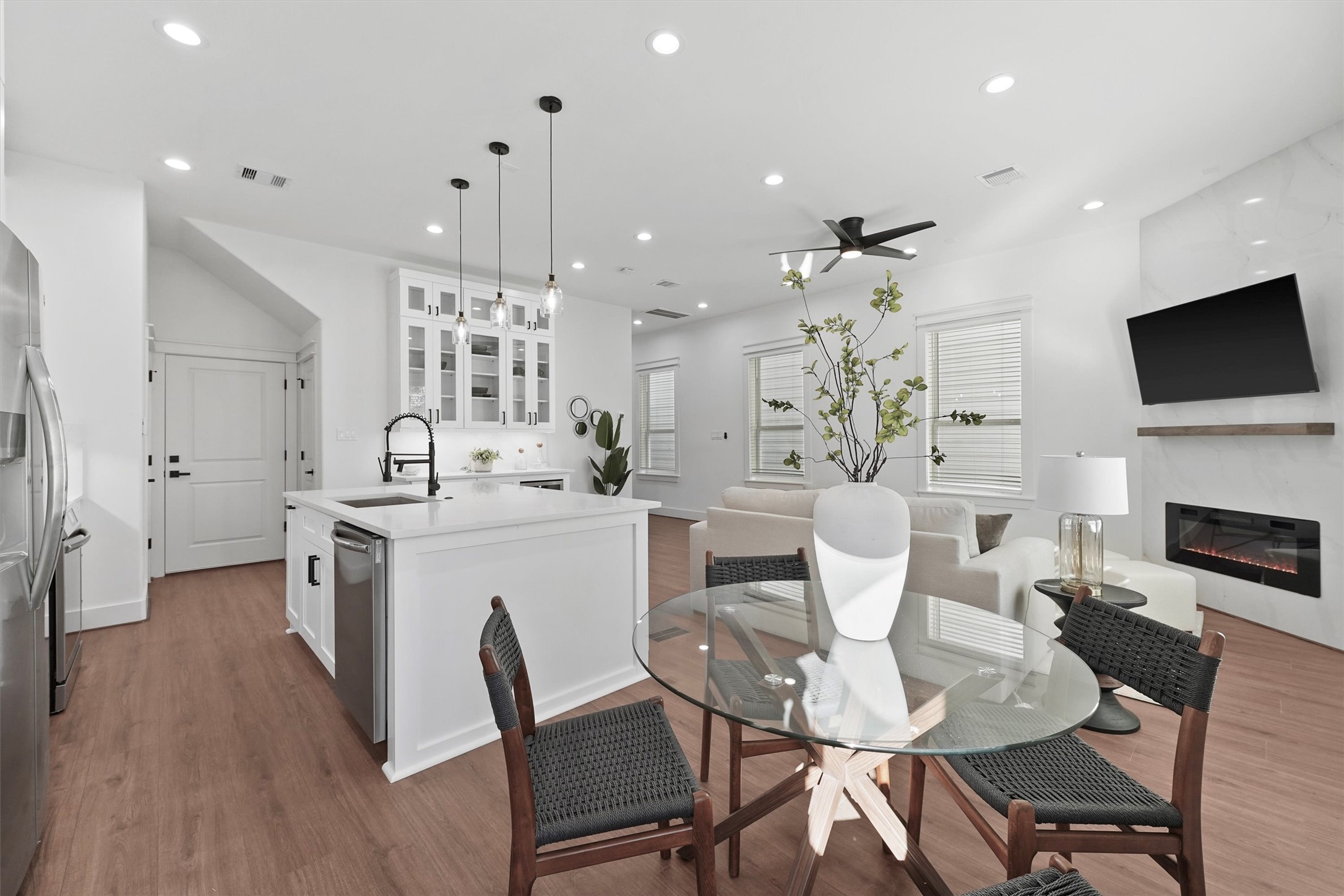 6130 Endeavor Heights Road Houston, TX 77091 - Photo 6 of 33 a view of a dining room with furniture and wooden floor