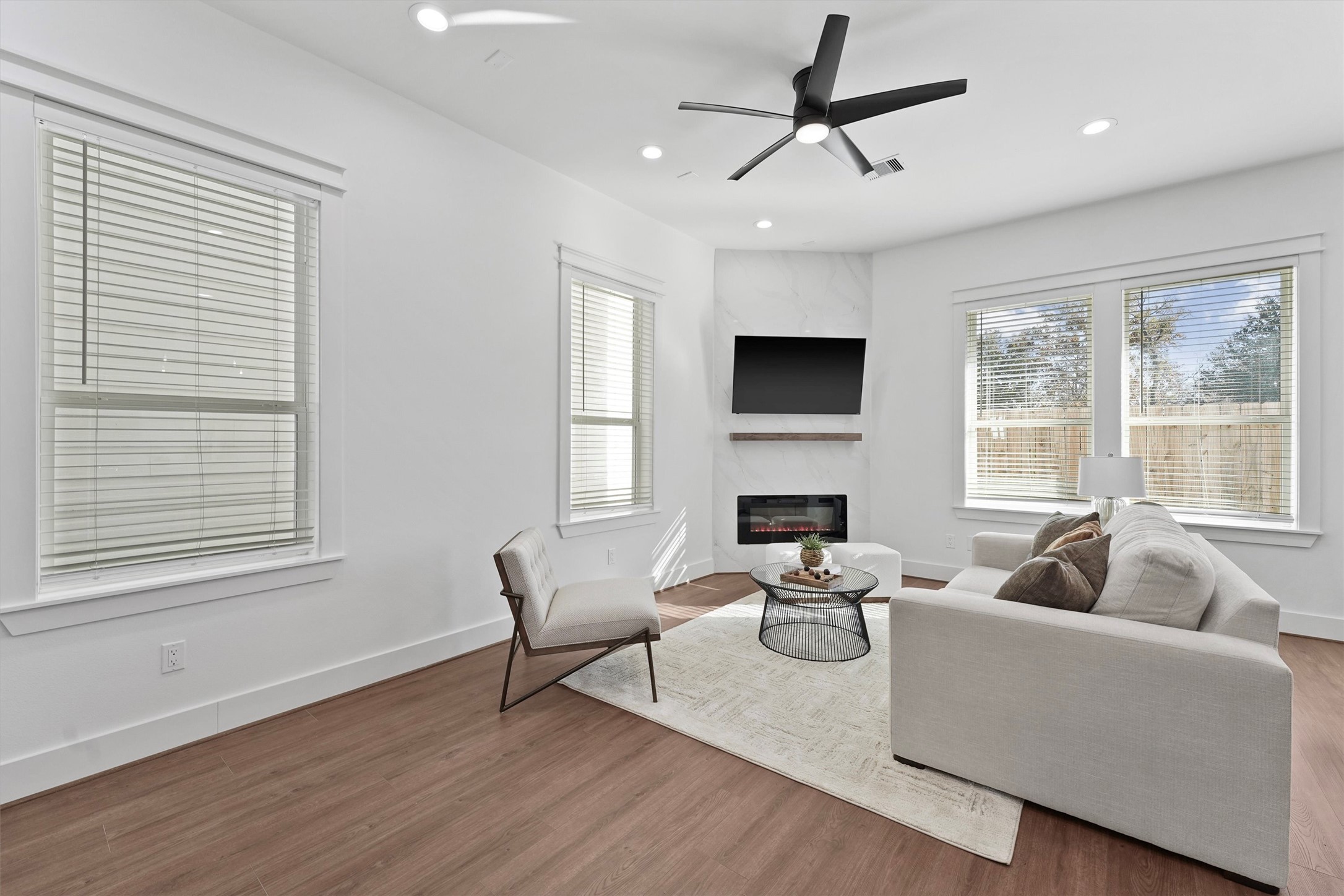 6130 Endeavor Heights Road Houston, TX 77091 - Photo 8 of 33 a living room with furniture fireplace and a flat screen tv