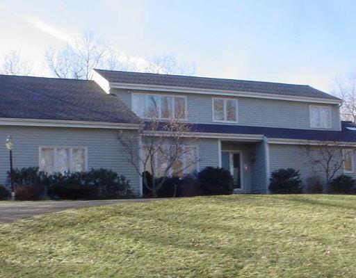 331 Thayer Pond Road Wilton, CT 06897 - Photo 1 of 1 a front view of a house with a garden