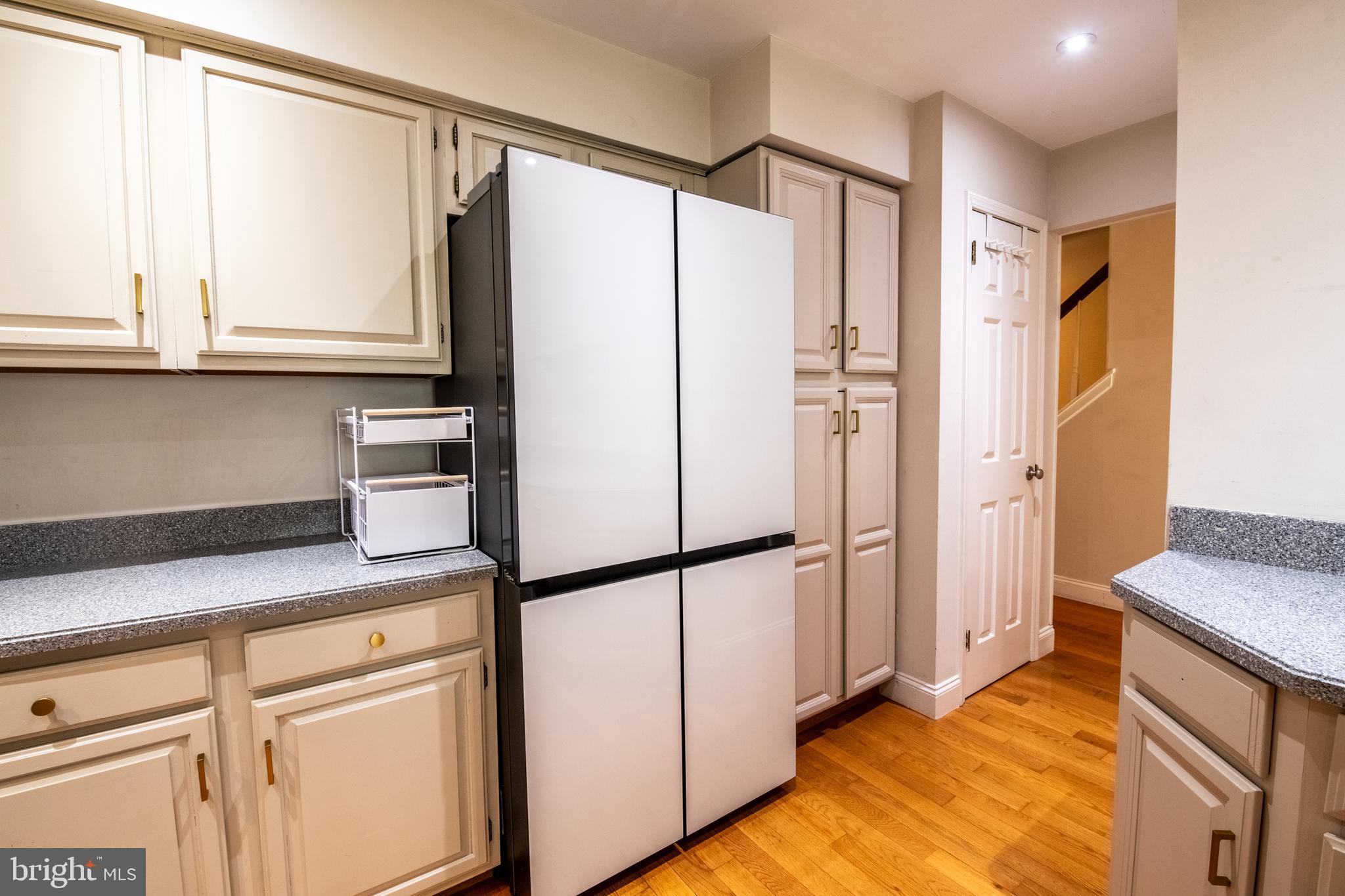 1197 Heyward Road, Unit 35 Chesterbrook, PA 19087 - Photo 14 of 44 a kitchen with stainless steel appliances granite countertop a refrigerator and a sink