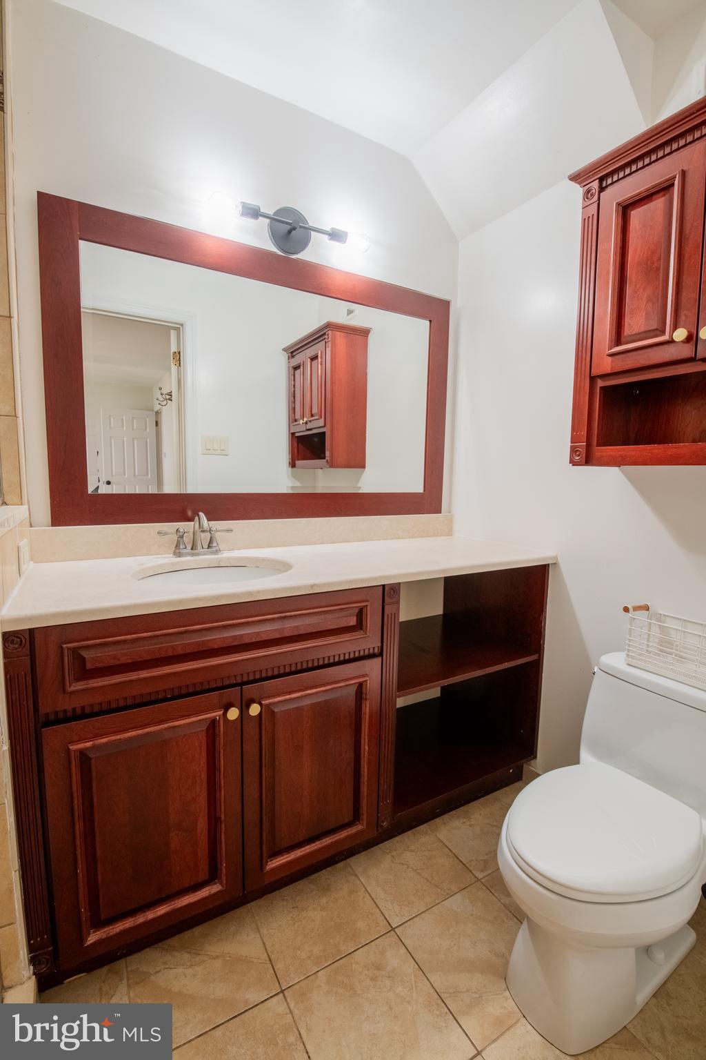 1197 Heyward Road, Unit 35 Chesterbrook, PA 19087 - Photo 23 of 44 a bathroom with a sink a toilet and mirror