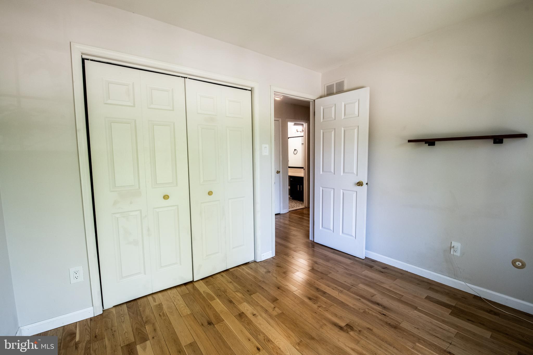 1197 Heyward Road, Unit 35 Chesterbrook, PA 19087 - Photo 26 of 44 a view of an empty room with wooden floor