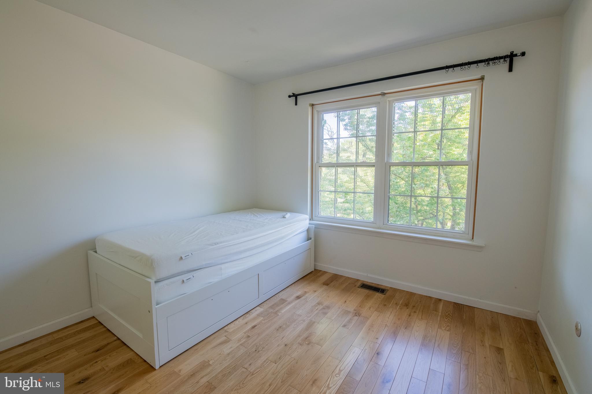 1197 Heyward Road, Unit 35 Chesterbrook, PA 19087 - Photo 27 of 44 a view of room with window and hardwood floor