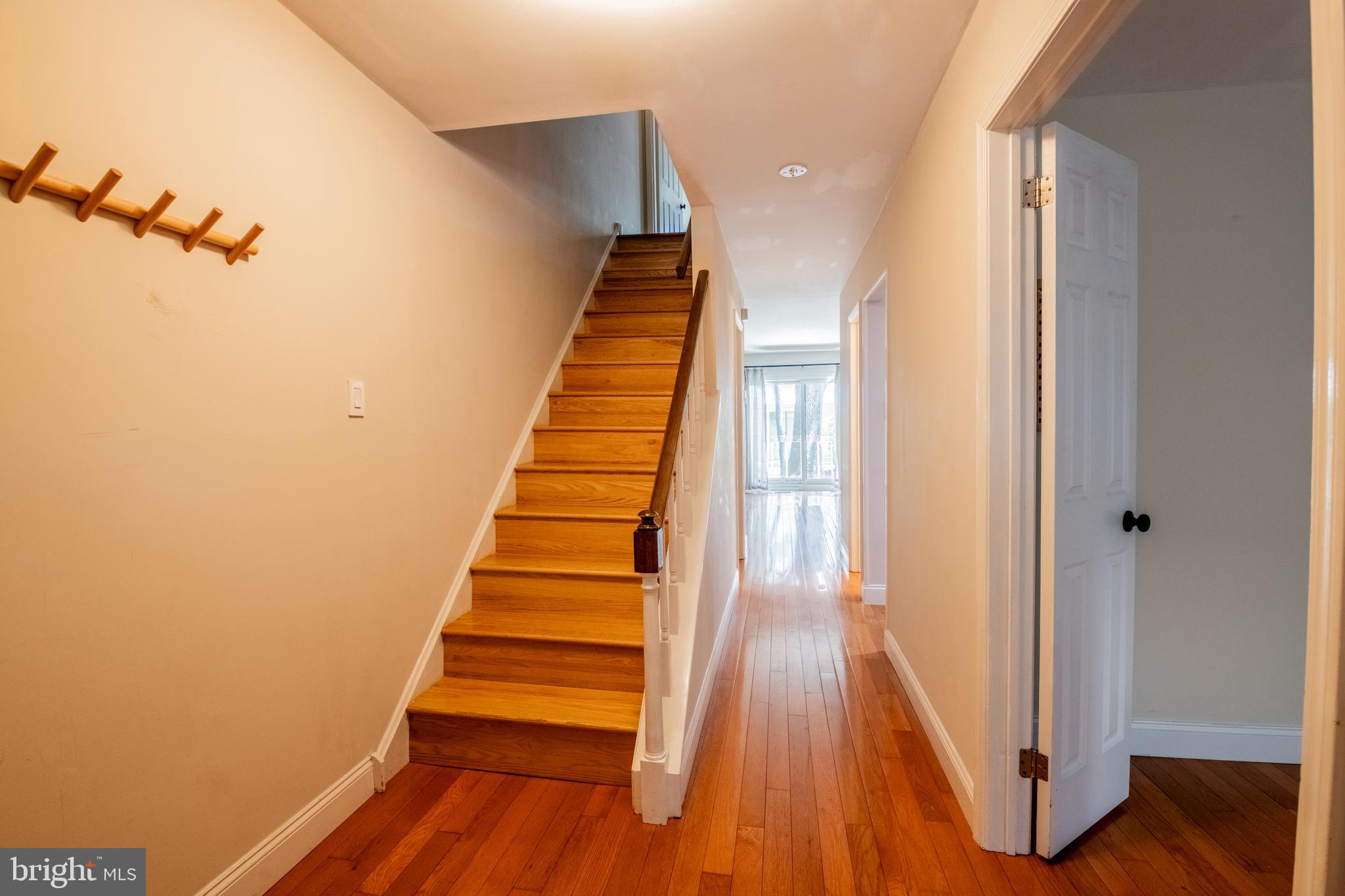1197 Heyward Road, Unit 35 Chesterbrook, PA 19087 - Photo 6 of 44 a view of a hallway with wooden floor and stairs