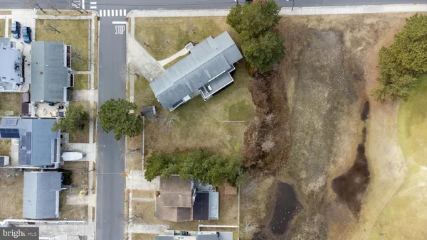 an aerial view of houses with yard