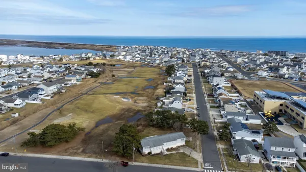 an aerial view of residential building and ocean