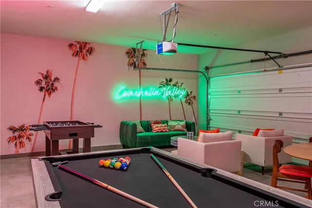 a swimming pool with outdoor seating and garden