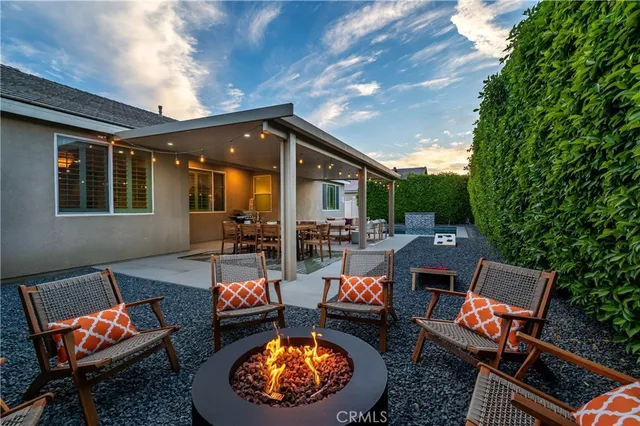 a outdoor space with the couches and dining table