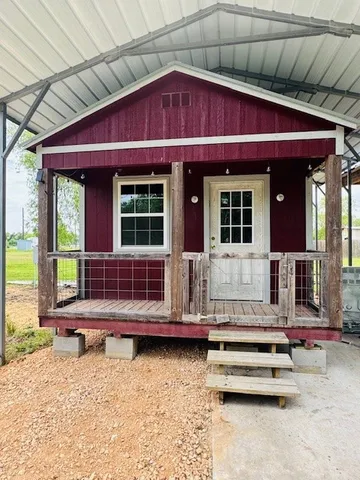 a view of house with outdoor space