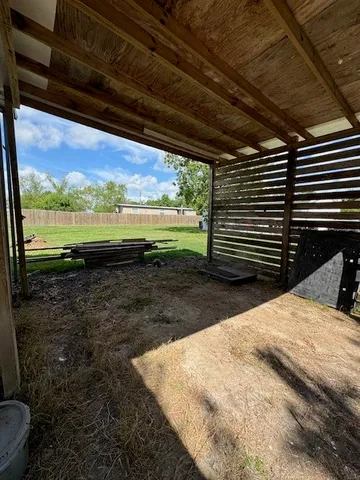 a view of a backyard of the house