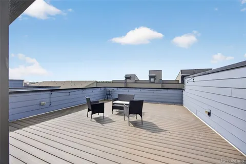 a view of a terrace with seating area