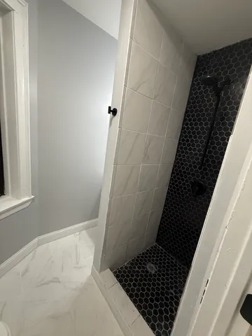a bathroom with a sink and a shower