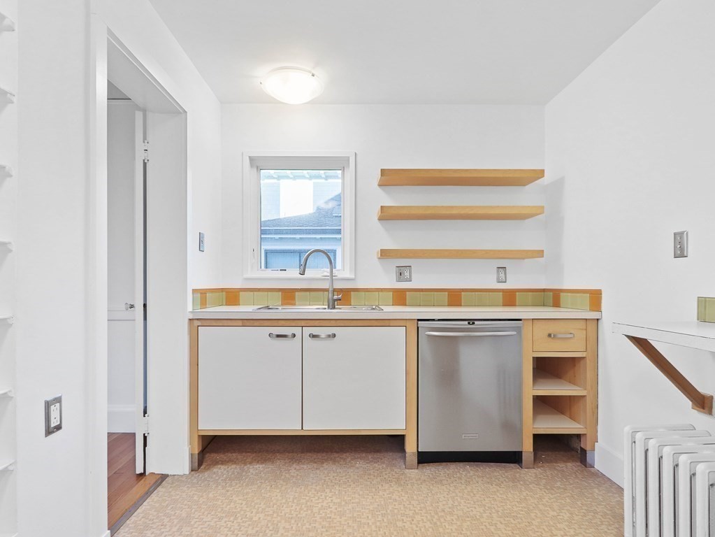 122 Albemarle Road Newton, MA 02460 - Photo 12 of 28 a room with a sink cabinets and a window