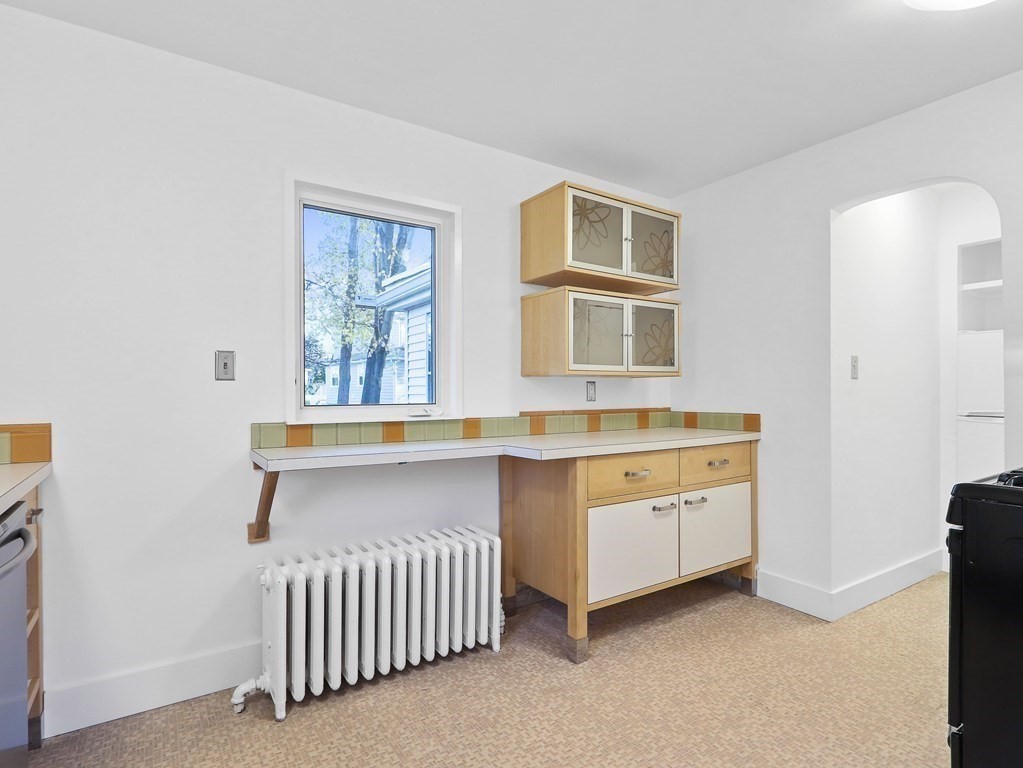 122 Albemarle Road Newton, MA 02460 - Photo 13 of 28 a bathroom with a sink and a mirror