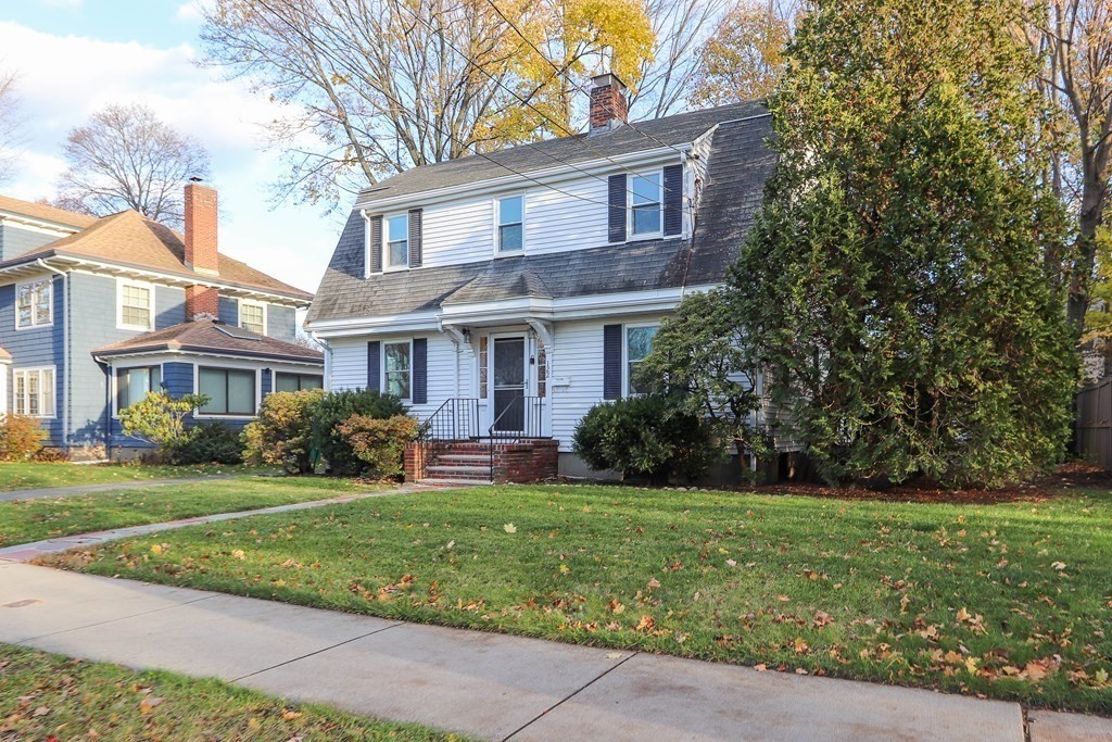 122 Albemarle Road Newton, MA 02460 - Photo 2 of 28 a view of a brick house with a yard in front of it