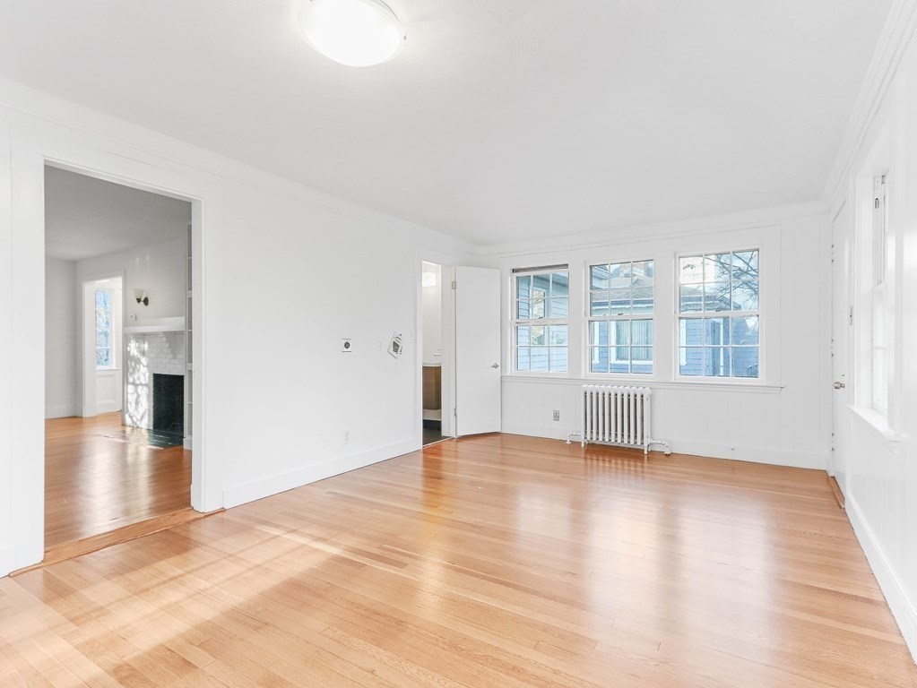 122 Albemarle Road Newton, MA 02460 - Photo 8 of 28 wooden floor in an empty room with a window