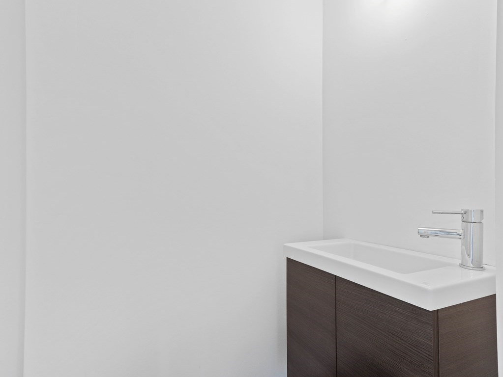 122 Albemarle Road Newton, MA 02460 - Photo 9 of 28 a bathroom with a sink and vanity