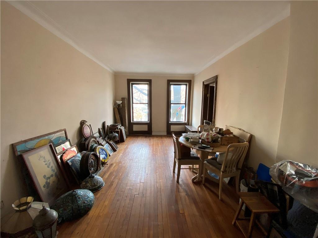 7912 3rd Avenue Brooklyn, NY 11209 - Photo 5 of 18 a living room with furniture and wooden floor